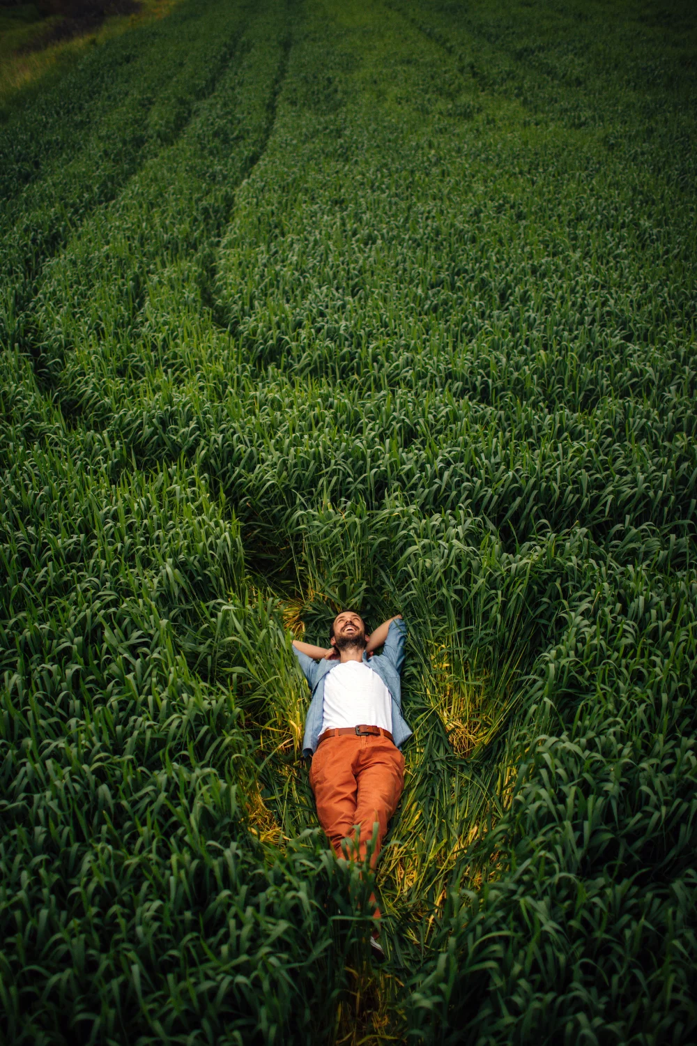 man laying in gras