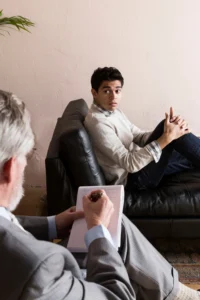 man seating on couch