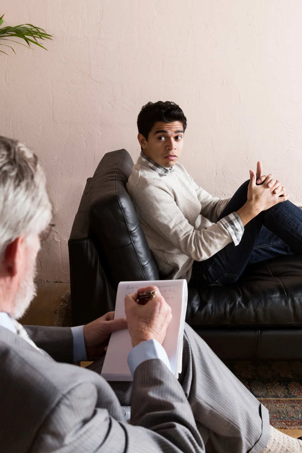 man seating on couch